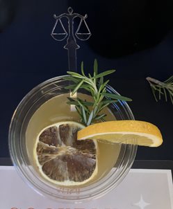 mocktail with scales of justice stirrer