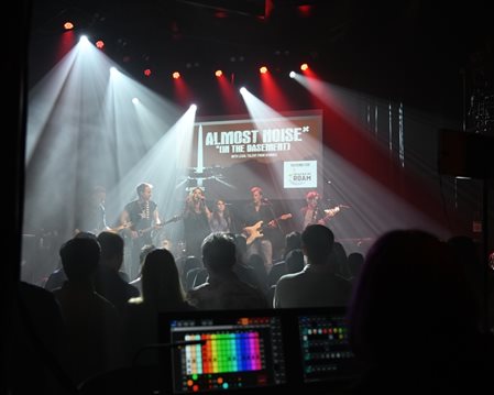 band on stage with lighting