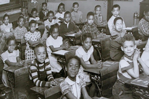 Black children sitting in a classroom, representing Brown vs. Board of Education