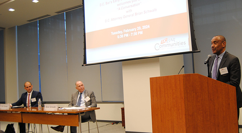 Kirkland & Ellis associate Eric Tarosky, D.C. Attorney General Brian Schwalb, and D.C. Bar President Charles R. Lowery Jr.