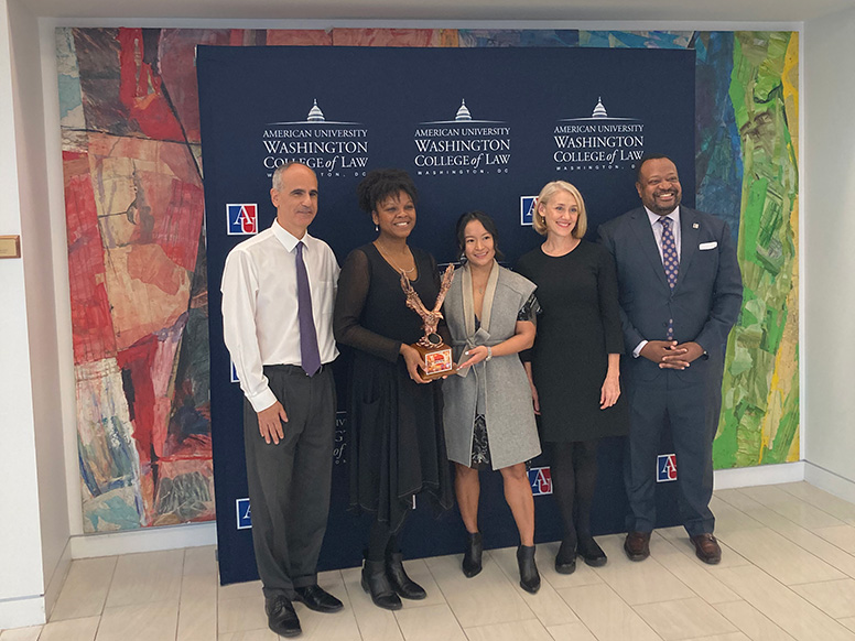 From left to right: Associate Dean of Student Affairs David Jaffe, Professor Angi Porter, guest judge Gigi Arandid, Professor Christine Farley, and Dean Roger Fairfax.